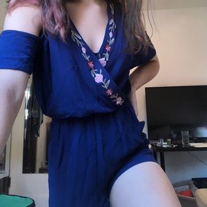 Francesca’s navy blue embroidered floral romper
